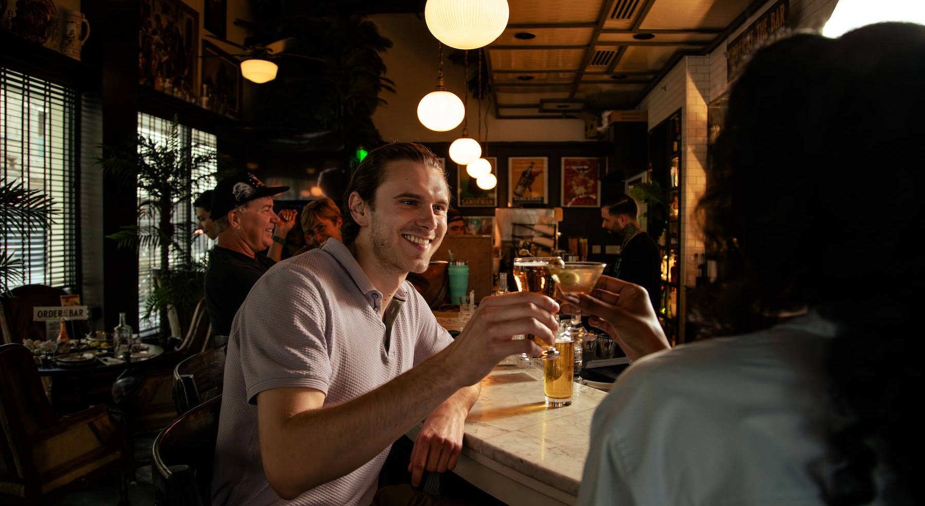 people enjoying drinks at a bar